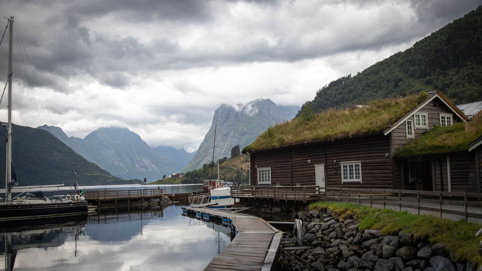 Fjord shoreline and minimalist timber cabin