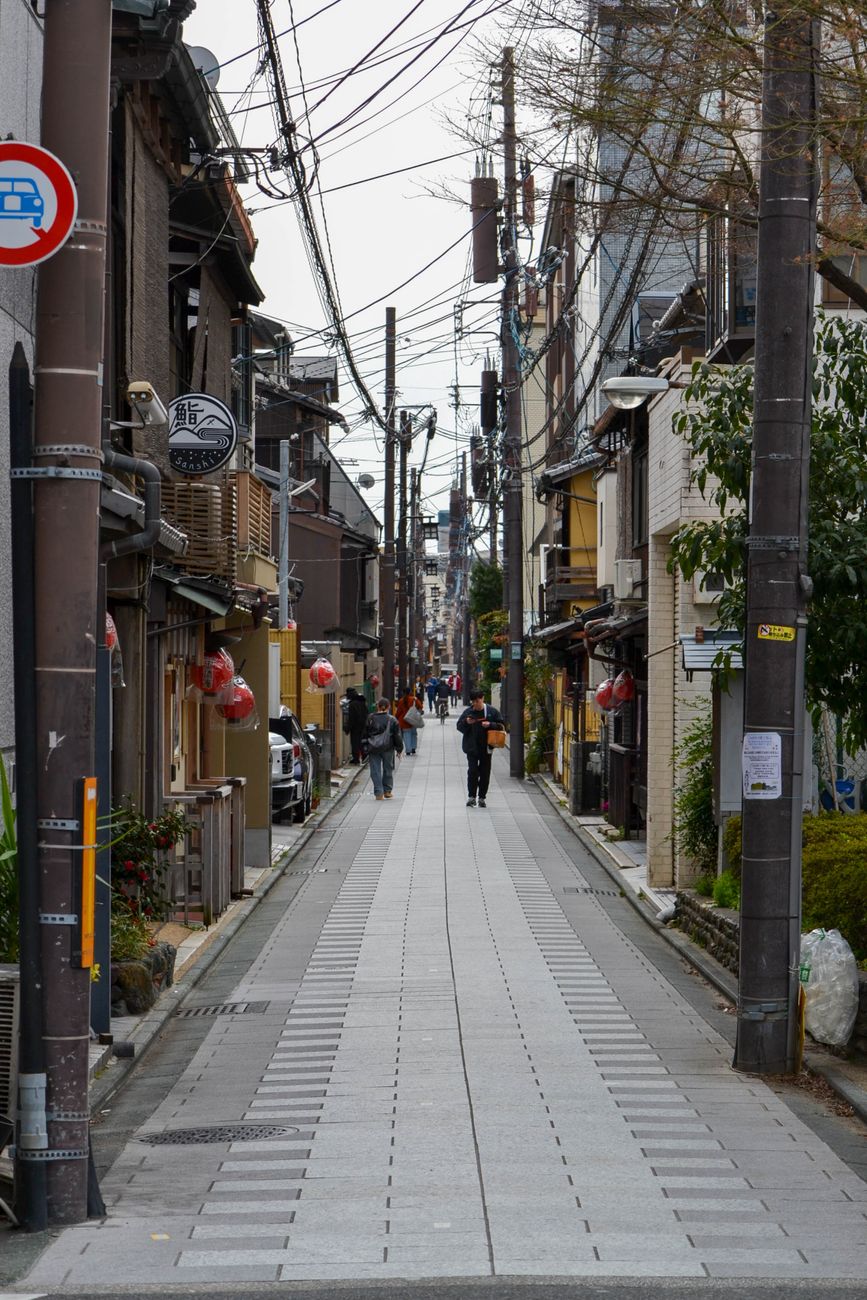 Kyoto traditional wooden machiya entrance with lantern